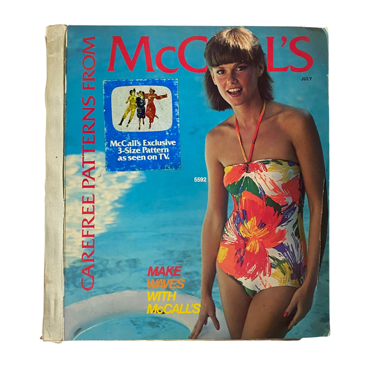 1977 July Carefree Patterns McCall's Summer Catalog featuring a model in a colorful swimsuit by a pool with the text that reads 'Make Waves with McCall's' and promotional details for exclusive patterns.