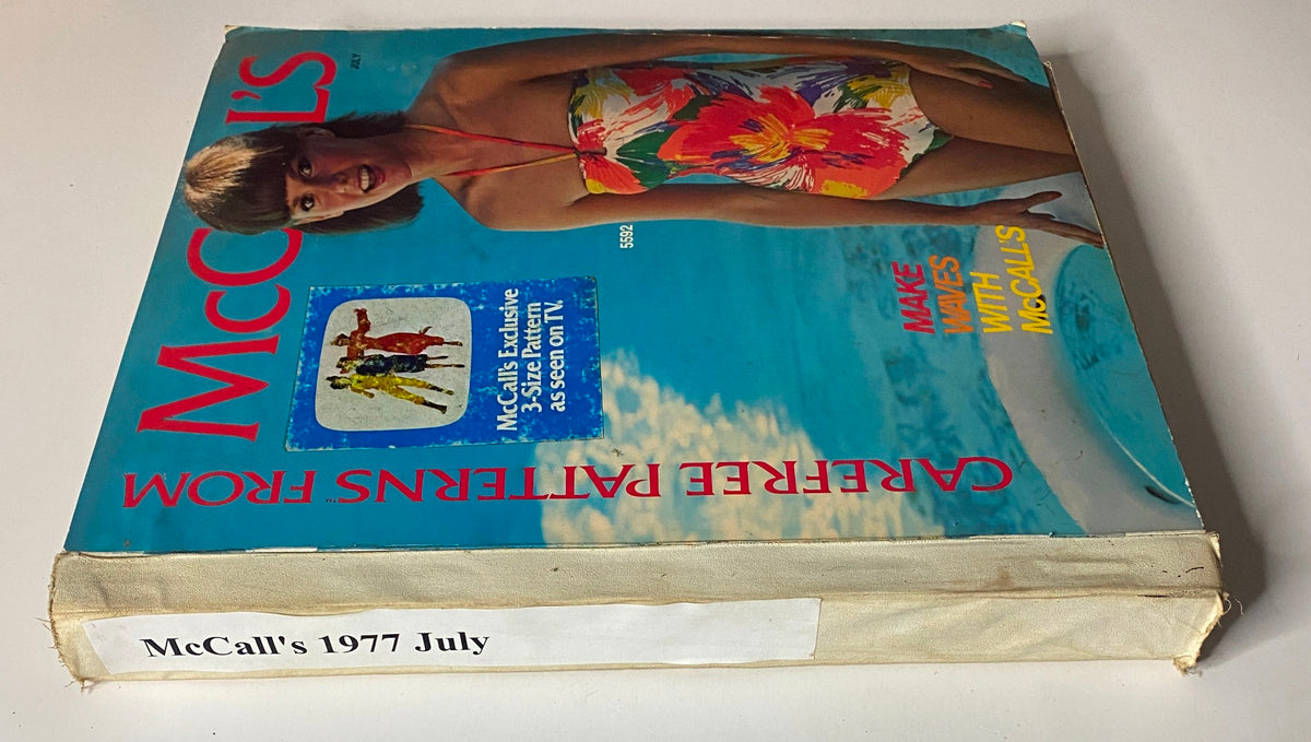 Cover of the 1977 July Carefree Patterns McCall's Summer Catalog featuring a model in a colorful swimsuit, promoting simple and stylish sewing patterns for summer outfits.