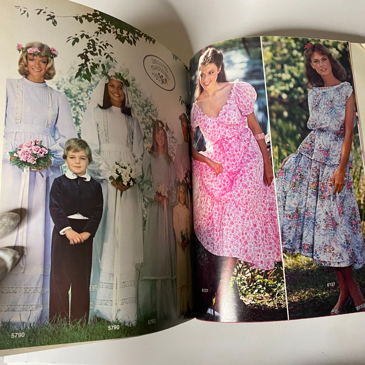 1977 July Carefree Patterns from McCall's Summer Huge Store Retail Catalog featuring wedding attire with models in vintage dresses and contemporary floral designs.