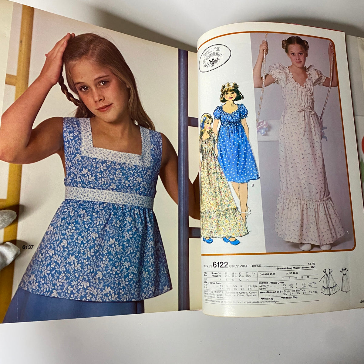 1977 July Carefree Patterns from McCall's Summer Huge Store Retail Catalog highlighting children's fashion with a girl in a blue floral outfit next to various dress patterns.