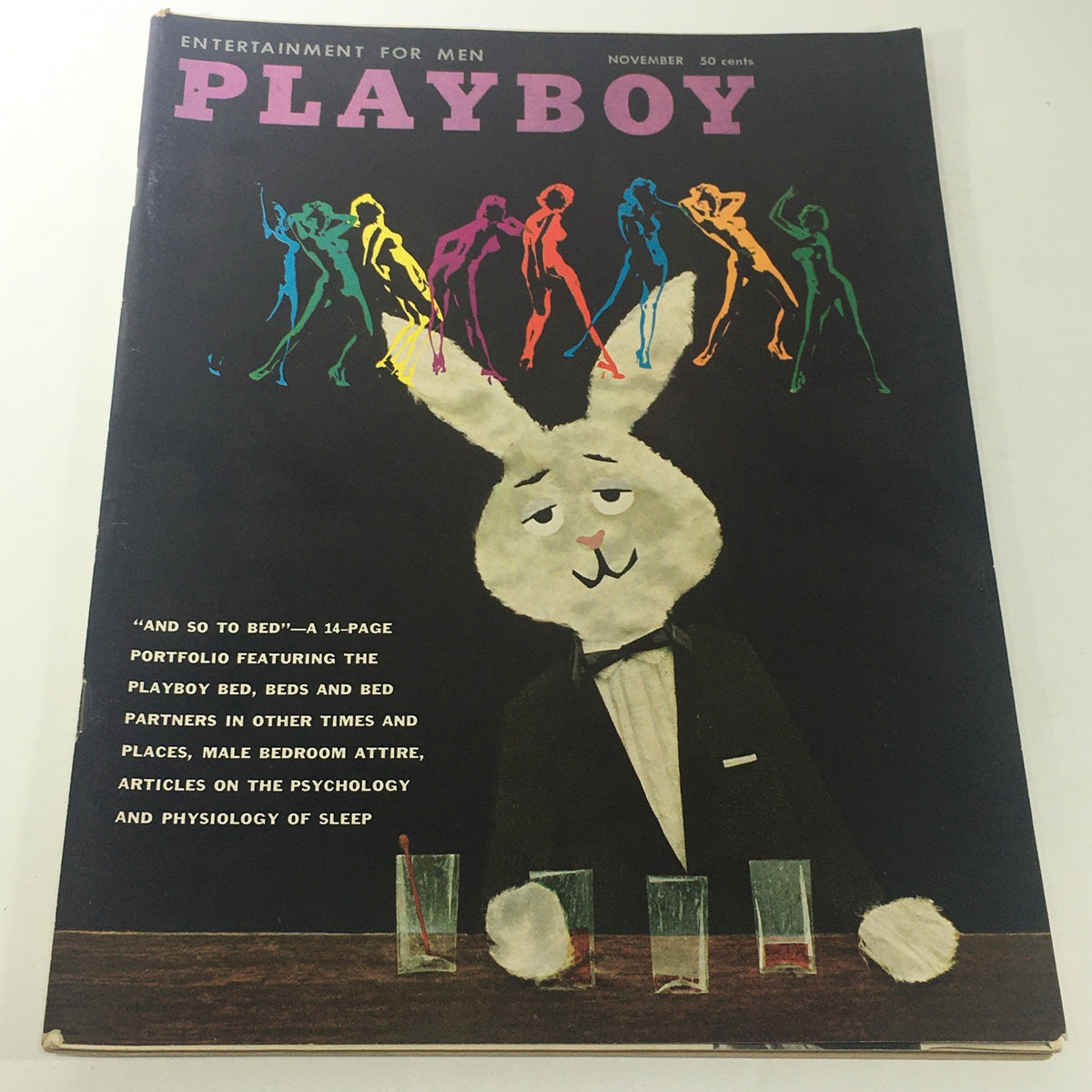 Cover of the VTG Playboy Magazine from November 1959 featuring a colorful design with a cartoon rabbit in a tuxedo, promoting a Portfolio of Playboy Beds & Bed Partners.