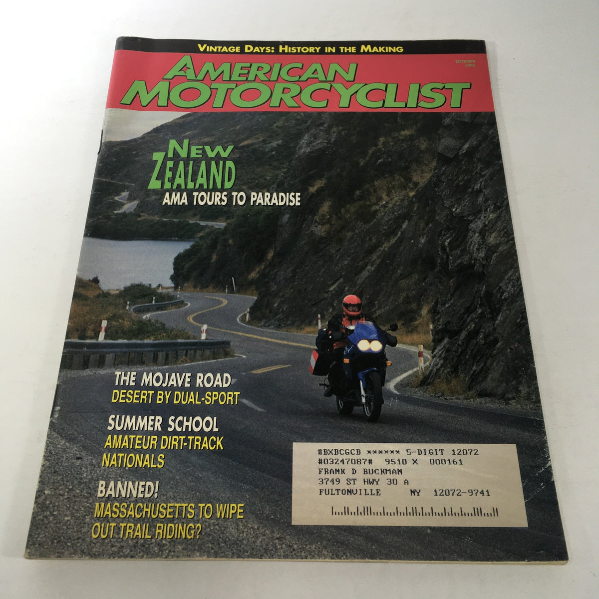 Cover of VTG American Motorcyclist Magazine: October 1995 featuring the New Zealand AMA Tour Paradise, showcasing a scenic motorcycle route with a rider on a winding road.