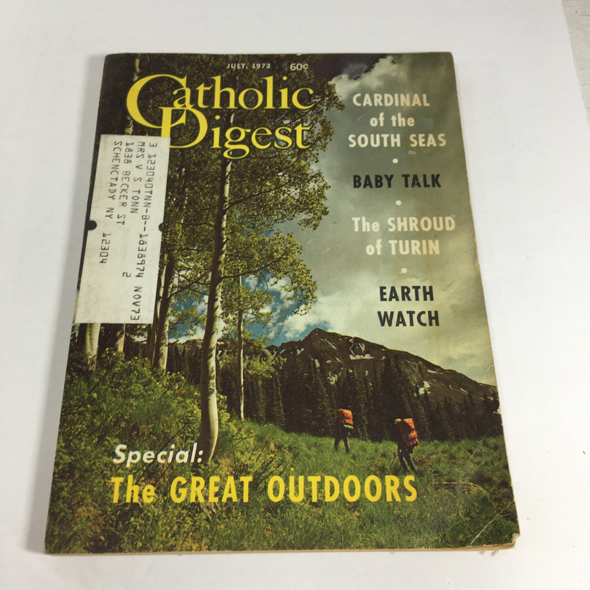 Cover of the July 1973 Catholic Digest Magazine featuring the title 'Cardinal of the South Seas / Baby Talk'. The magazine showcases lush green trees and hikers in the background, emphasizing themes of nature and spirituality. Collectible vintage magazine in good condition.