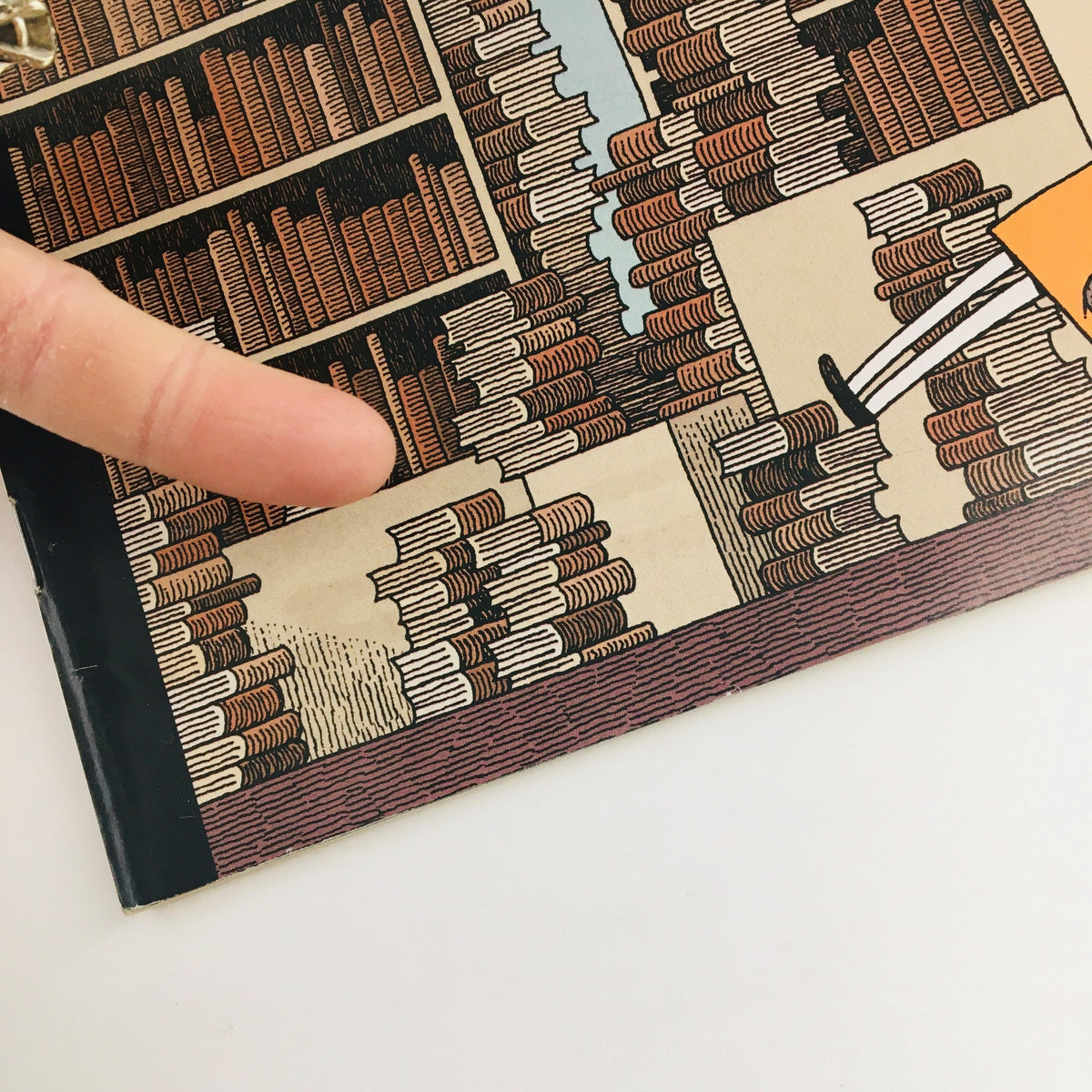 Close-up view of The New Yorker October 20 2014 magazine cover, highlighting the intricate details of the bookshelf illustration by Tom Gauld.