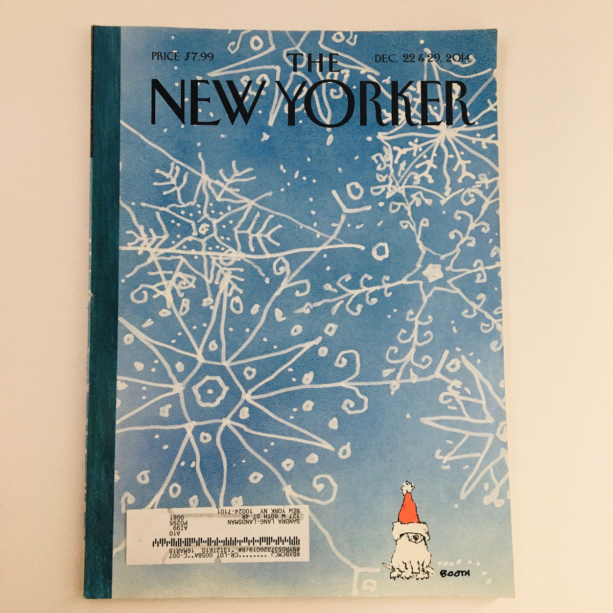 The New Yorker December 22, 2014 cover featuring a blue background adorned with snowflakes, illustrated by George Booth. This artistic magazine cover reflects the creativity and humor characteristic of The New Yorker, making it a valuable collectible.