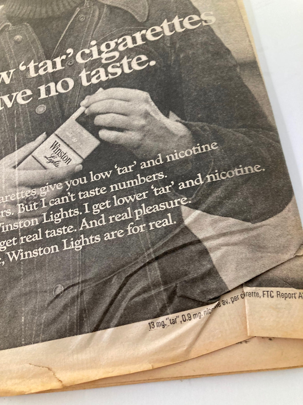 National Enquirer Tabloid October 26 1976 featuring an advertisement for Winston Lights cigarettes, showcasing a hand holding a cigarette pack with a vintage design.