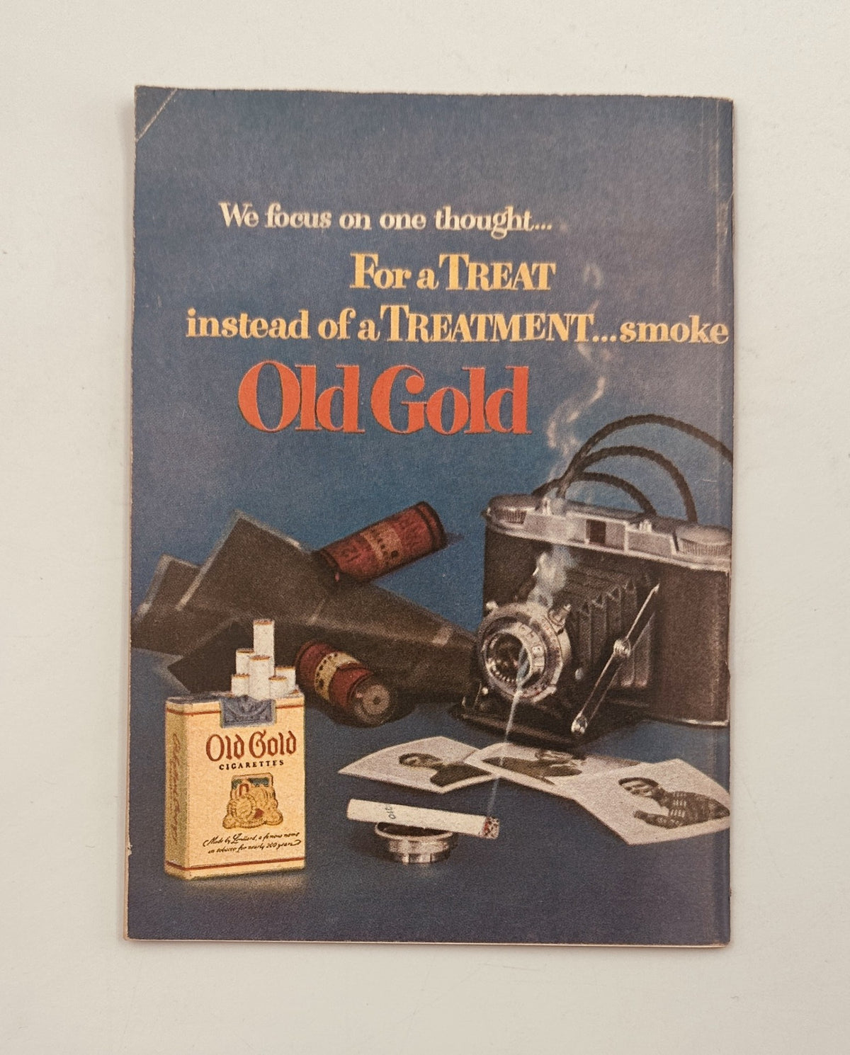 Vintage advertisement in Quick Magazine, July 2, 1951 promoting Old Gold cigarettes with a camera and smoking theme.