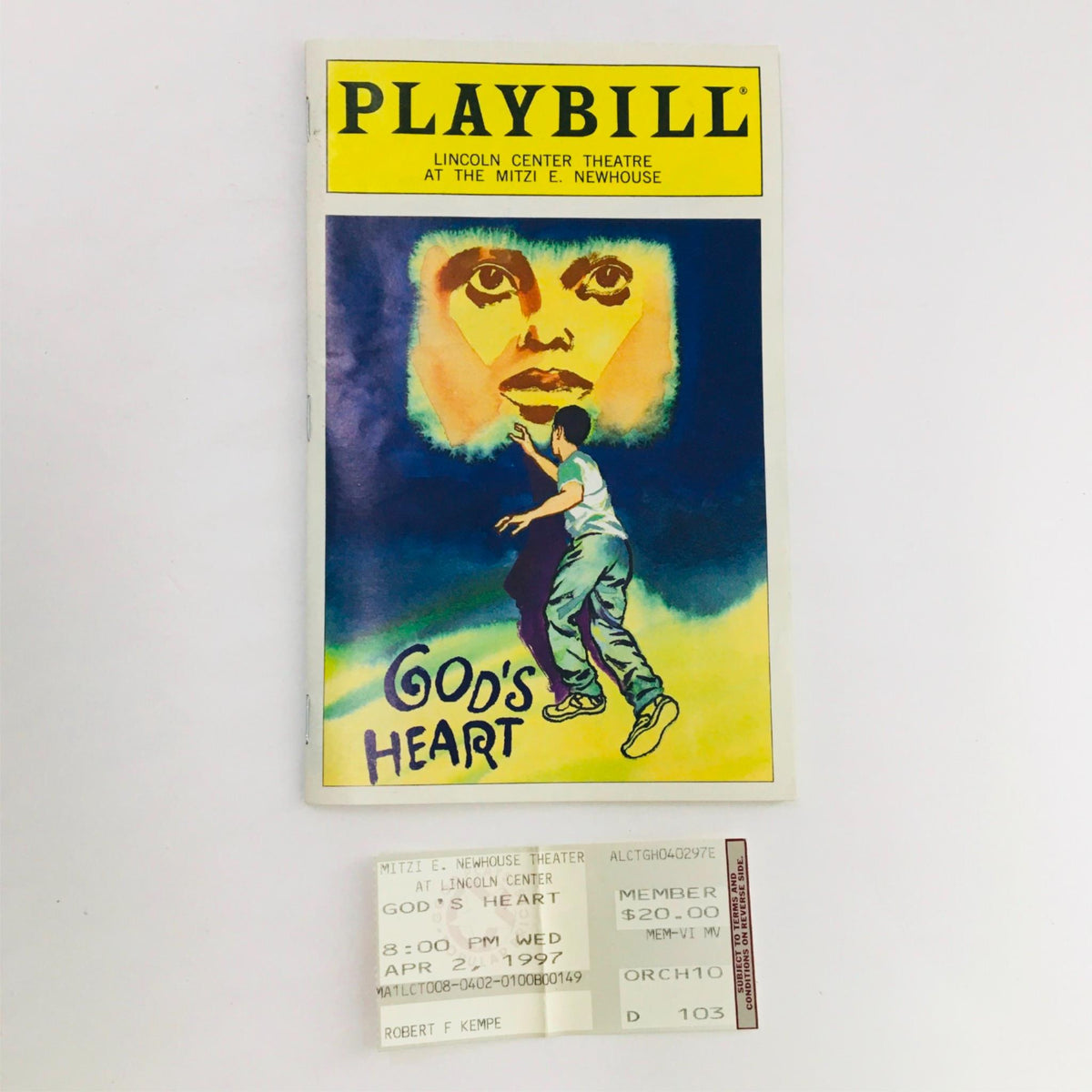 1997 Playbill for 'God's Heart' by Craig Lucas and Joe Mantello at Lincoln Center Theatre, featuring a colorful cover illustration and an original ticket from the performance dated April 27, 1997.