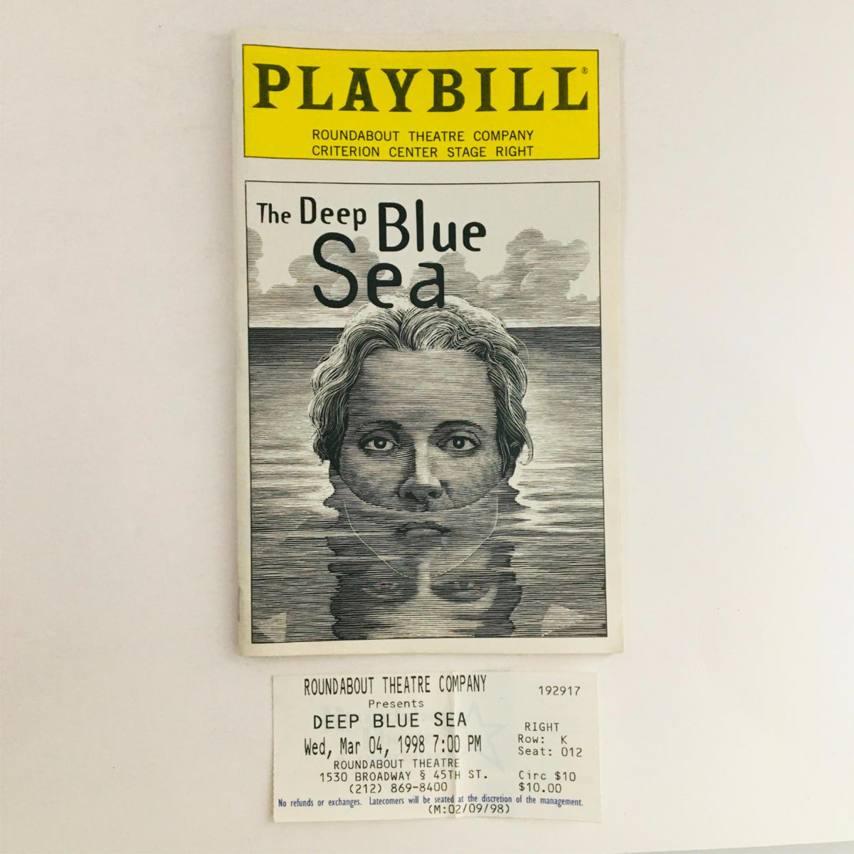 1998 Playbill for The Deep Blue Sea directed by Mark Lamos at Criterion Center Stage Right, featuring an artistic cover illustration of a woman submerged in water, along with original ticket stubs from the performance.