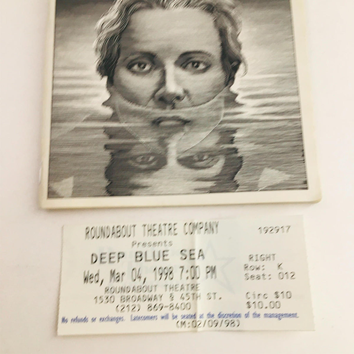 1998 Playbill The Deep Blue Sea by Mark Lamos at Criterion Center Stage Right, featuring the face of a character with reflections in water, along with the original ticket for the performance on March 4, 1998.
