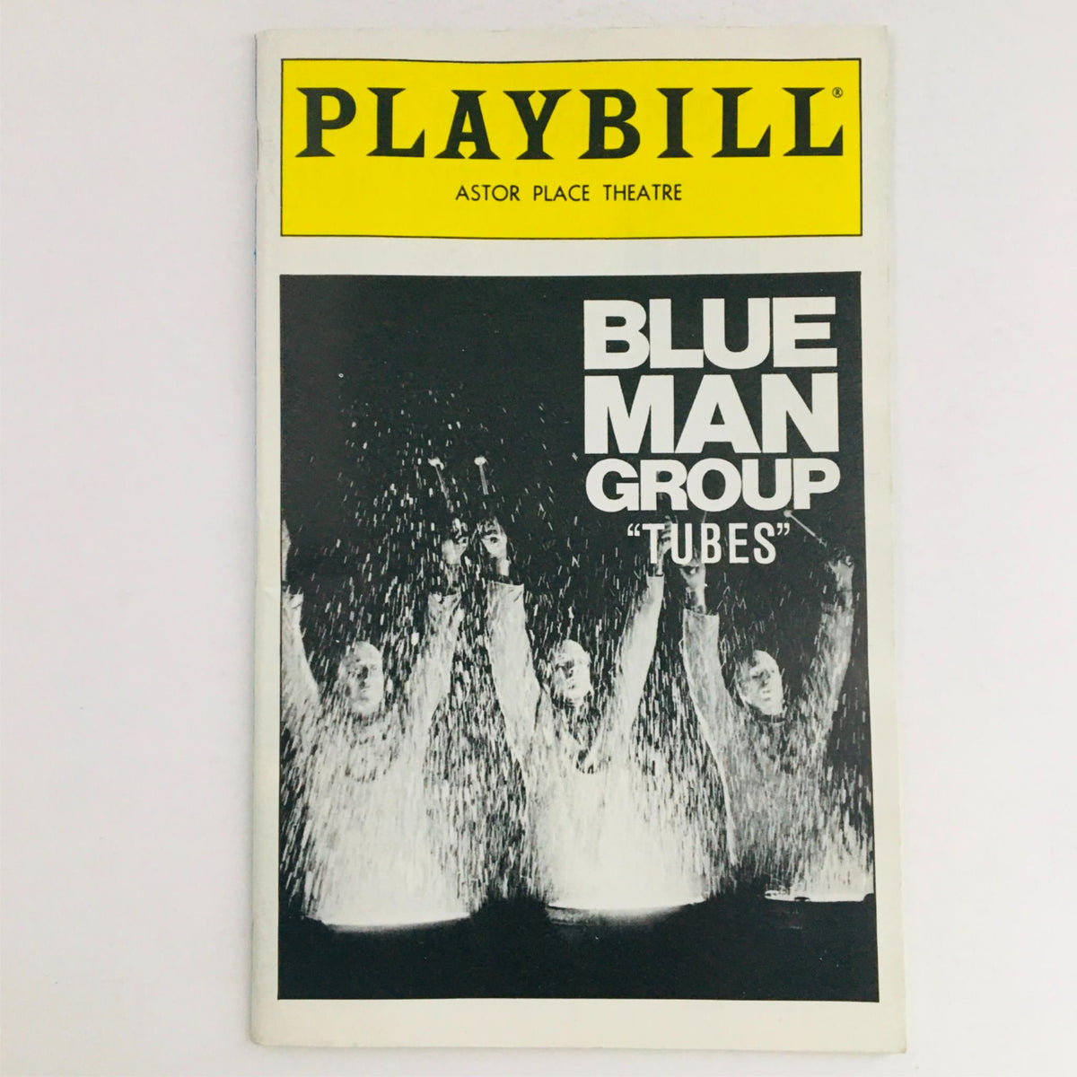 1996 Playbill Tubes by Blue Man Group featuring Marlene Swartz, cover image showing the cast performing with water spray at Astor Place Theatre.