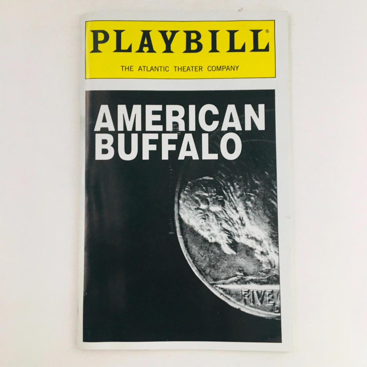 2000 Playbill for American Buffalo by David Mamet, featured at Atlantic Theatre Company, showcasing a bold black and white design with iconic imagery.