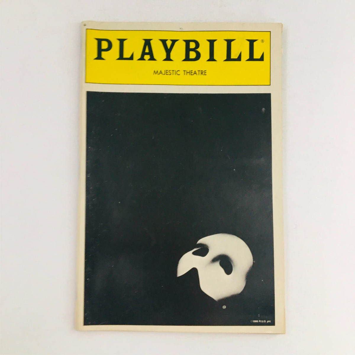 1988 Playbill for Phantom of the Opera by Harold Prince, featuring a classic black cover with the iconic mask logo, from the Majestic Theatre.