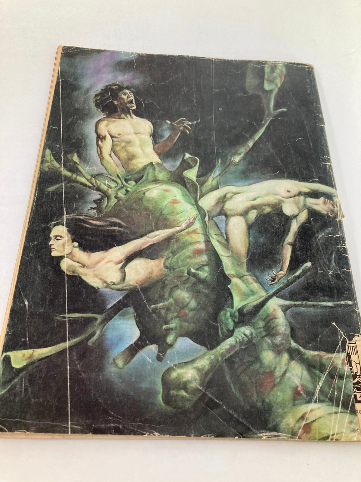 Cover page of the VTG Heavy Metal Magazine September 1979 issue 'The Spirit of the Game' displaying a striking illustration of fantastical characters in vibrant colors, highlighting age-related wear and vintage appeal.
