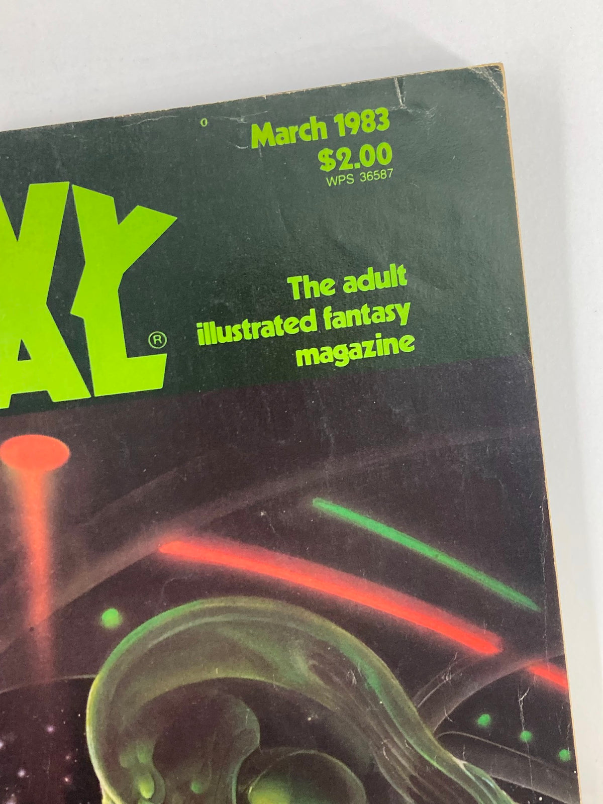Close-up of the cover details of VTG Heavy Metal Magazine March 1983 Vol 6 #12, revealing the magazine's title, publication date, and price.