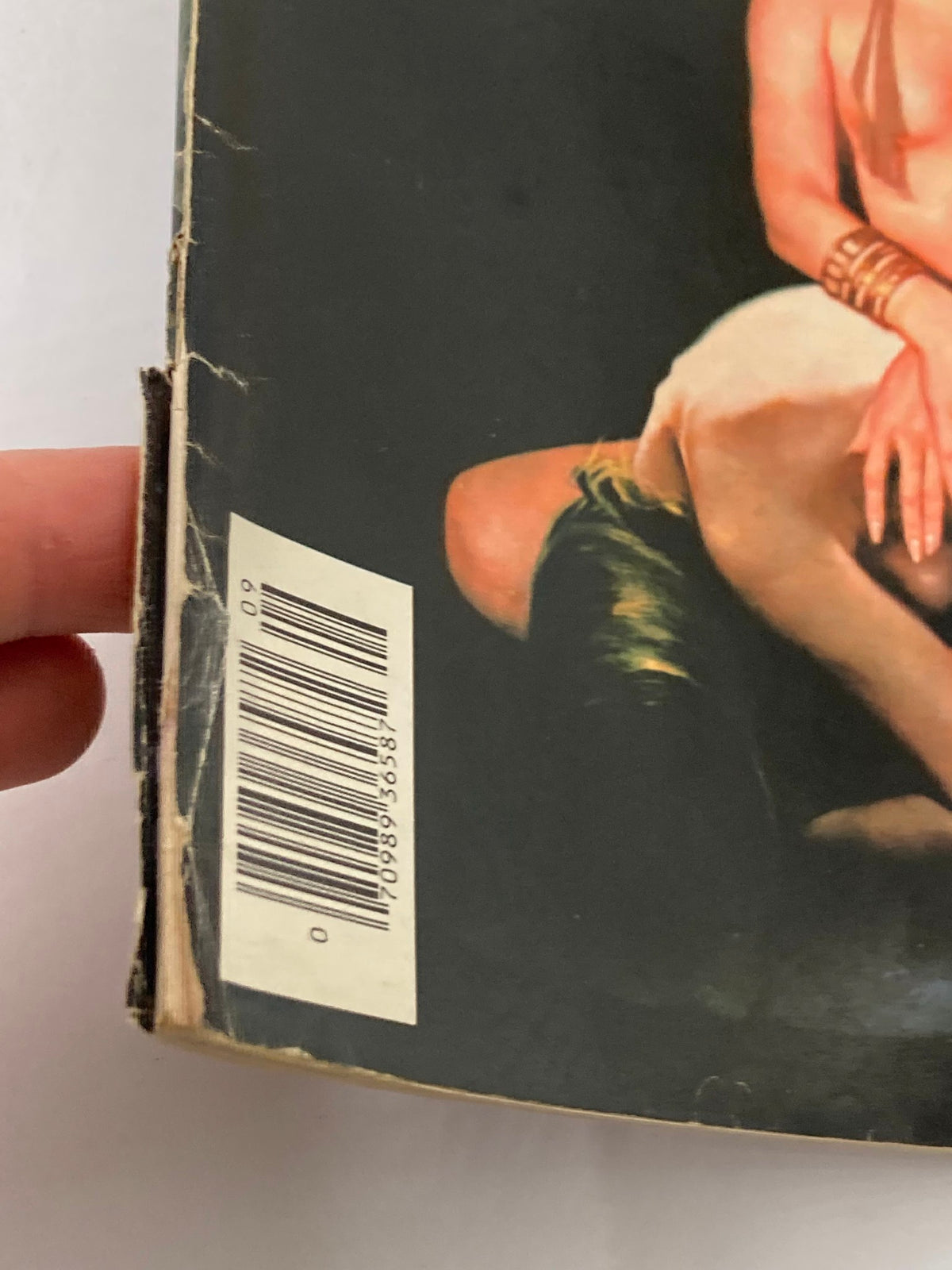 Close-up view of the back corner of the VTG Heavy Metal Magazine September 1983 featuring minor wear and a barcode, emphasizing its vintage condition.
