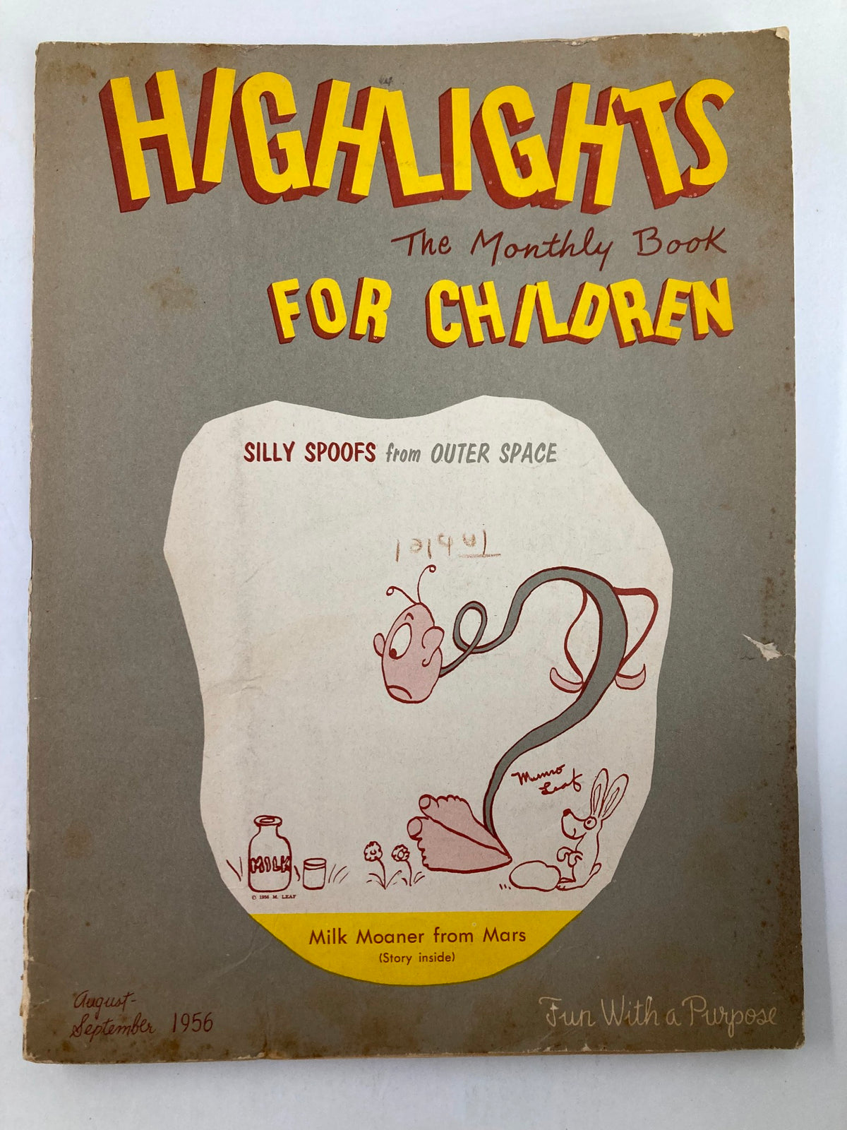 Cover of the VTG Highlights Magazine August 1956, featuring the title 'Milk Moaner from Mars', depicted with whimsical illustrations and the tagline 'Silly Spoofs from Outer Space'.