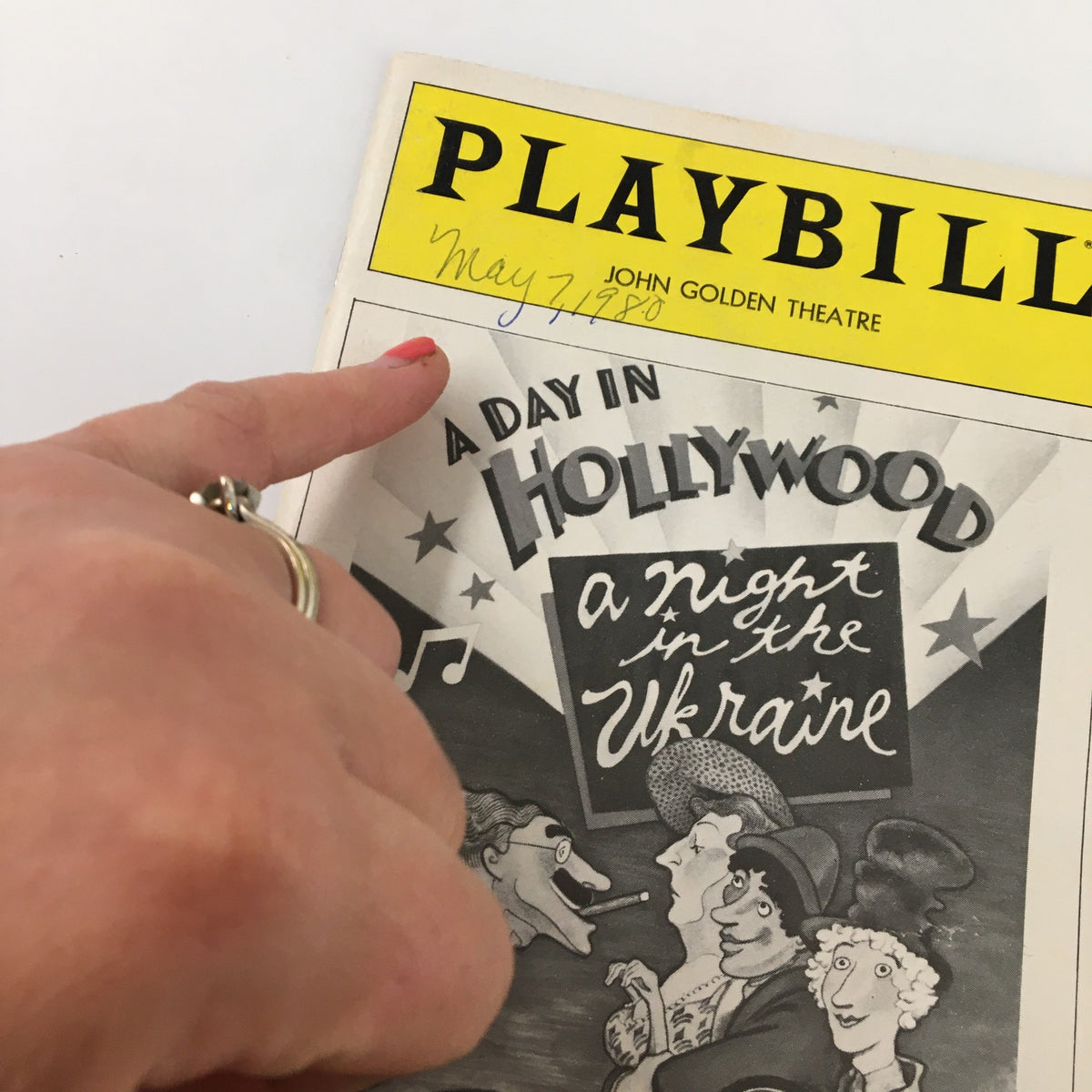 Close-up of the 1980 Playbill for A Day in Hollywood A Night in the Ukraine with a handwritten date on the cover.