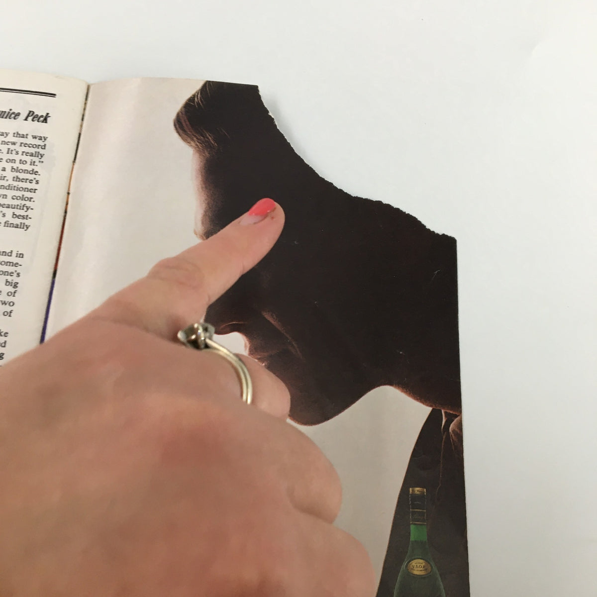 Close-up view of a partially torn page from the 1982 Playbill for Walnut Street Company’s production of A Flea in Her Ear, highlighting wear and character.