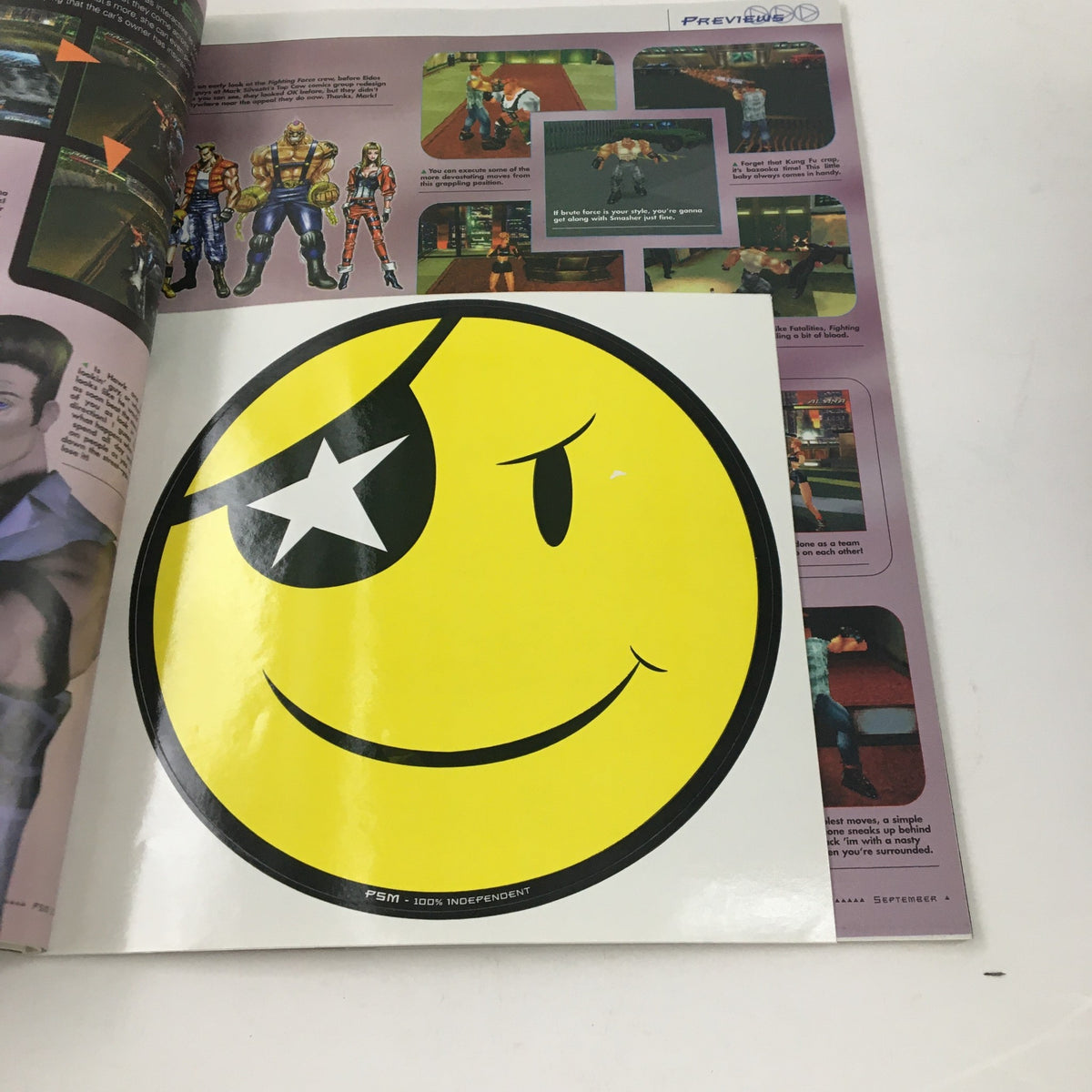 Unique sticker page in PlayStation Magazine September 1997 with the iconic smiley face logo.