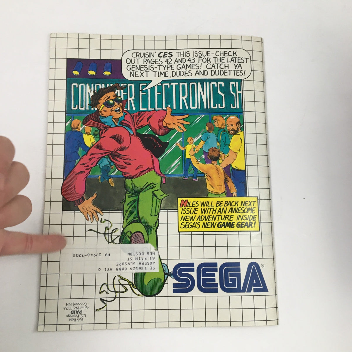 Back cover of SEGA Visions Magazine Summer 1991 featuring a cartoon character promoting upcoming SEGA games at the Consumer Electronics Show.