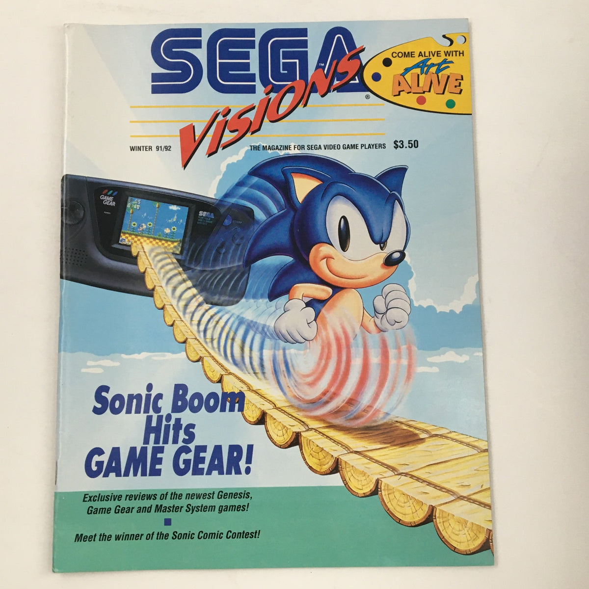 Cover of SEGA Visions Magazine Winter 1991 featuring Sonic the Hedgehog and the tagline 'Sonic Boom Hits Game Gear!' showcasing the Game Gear console.