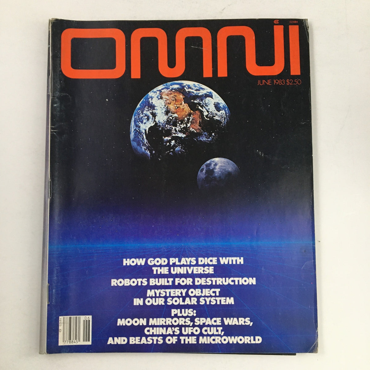 Cover of Omni Magazine June 1983 featuring the title 'How God Plays Dice with the Universe' and topics on robots, mystery objects in our solar system, with a cosmic background.