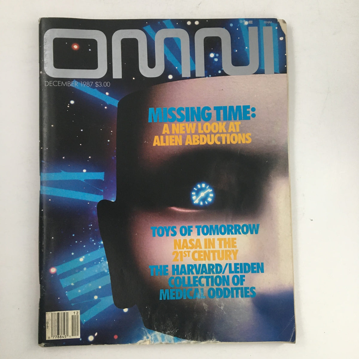 Cover of Omni Magazine December 1987 featuring the article 'Missing Time: A New Look at Alien Abductions' with a striking graphic and futuristic design.