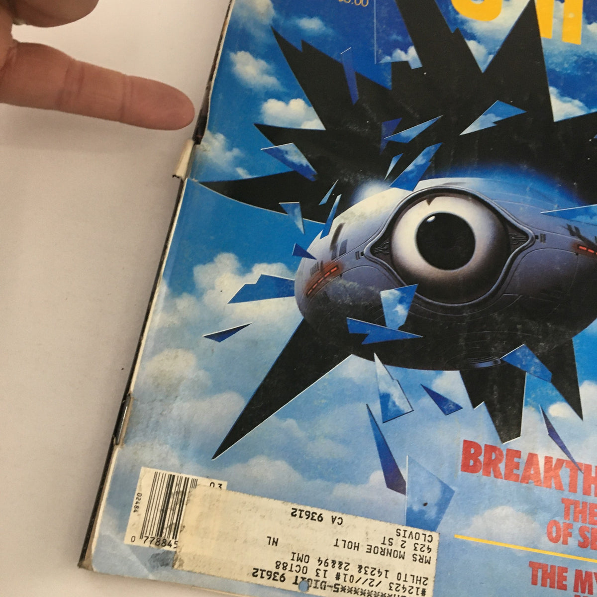 Close-up view of the cover of Omni Magazine March 1988, highlighting the design elements including the title 'Breakthrough: The Chemistry of Self-Healing' and 'The Mysteries of Nikola Tesla'. The cover features a distinct eye graphic with shards around it.