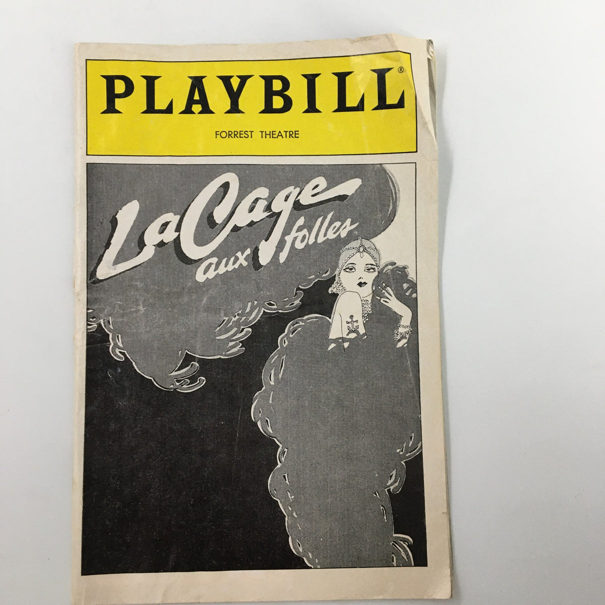 1983 Playbill for La Cage Aux Folles at Forrest Theatre, showcasing vintage theatrical art and design.