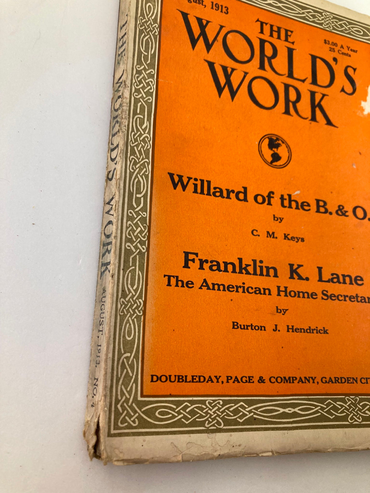 Close-up of the cover of VTG The World's Work Magazine August 1913, highlighting details of the title and signs of wear.