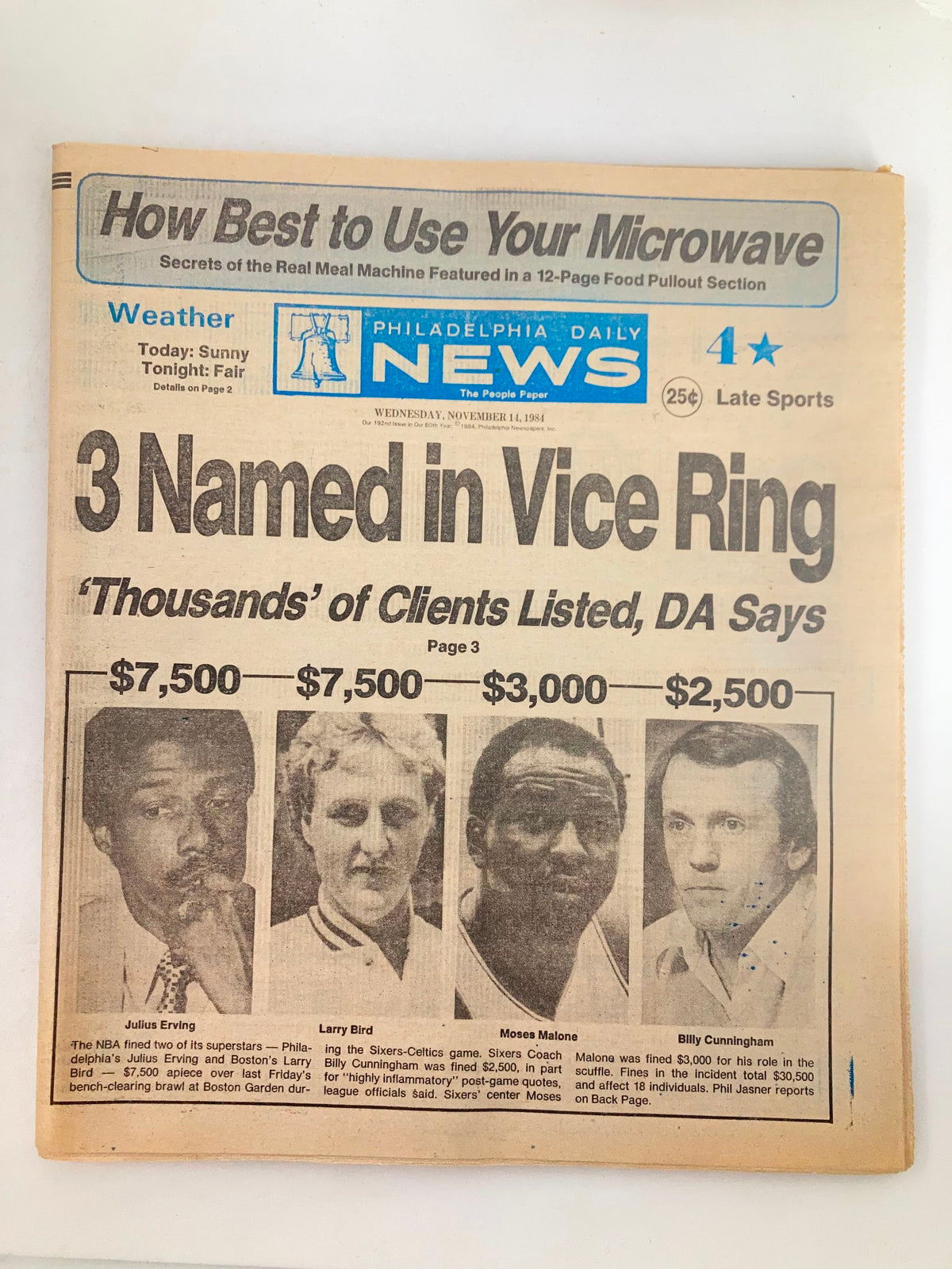 Philadelphia Daily News Tabloid from November 14, 1984, featuring basketball stars Julius Erving, Larry Bird, and Moses Malone on the cover, highlighting a significant sports event.