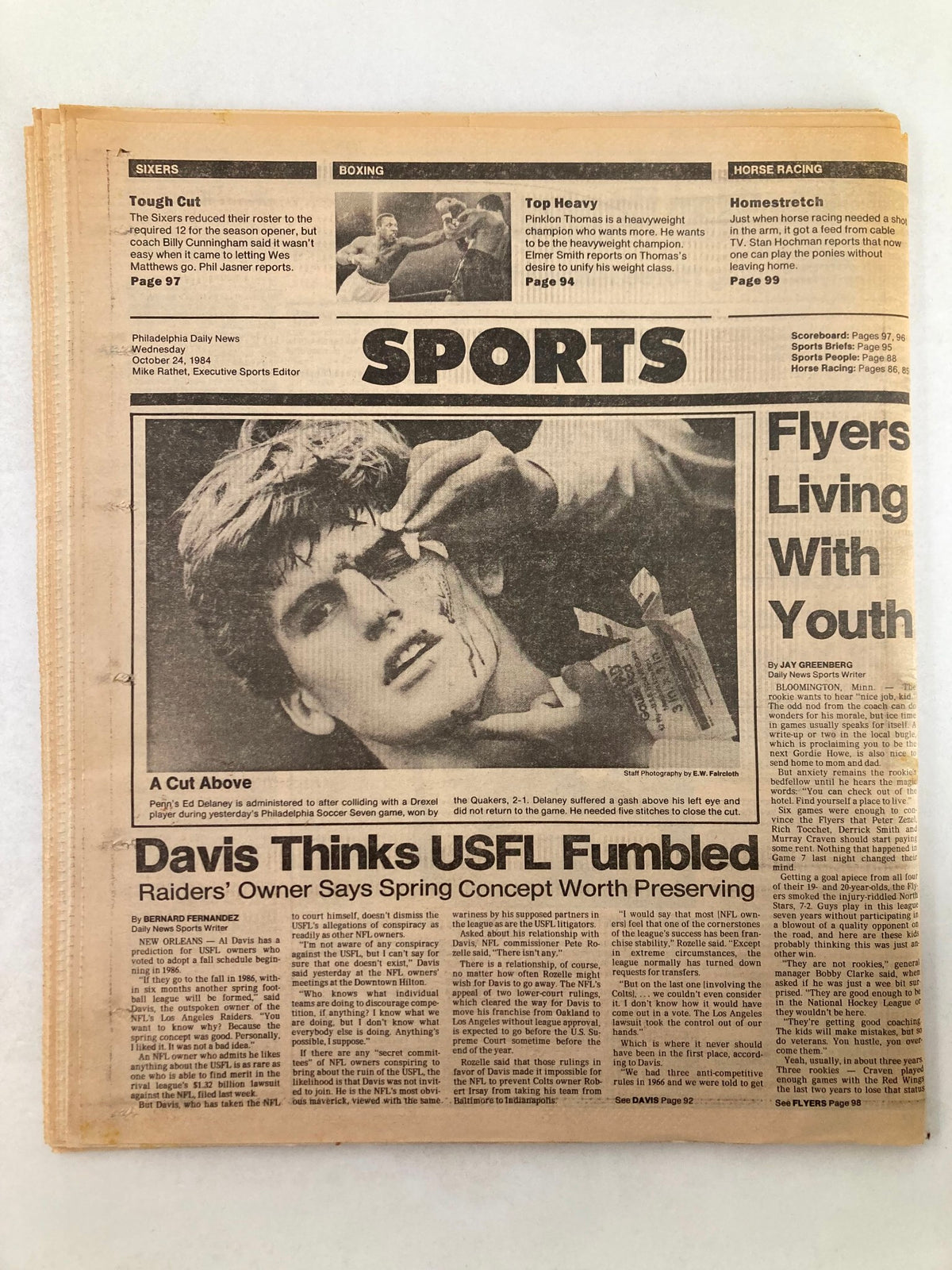 Philadelphia Daily News Tabloid from October 24, 1984, displaying sports section titled 'A Cut Above'. It includes coverage of a sports event featuring a player being treated for an injury.