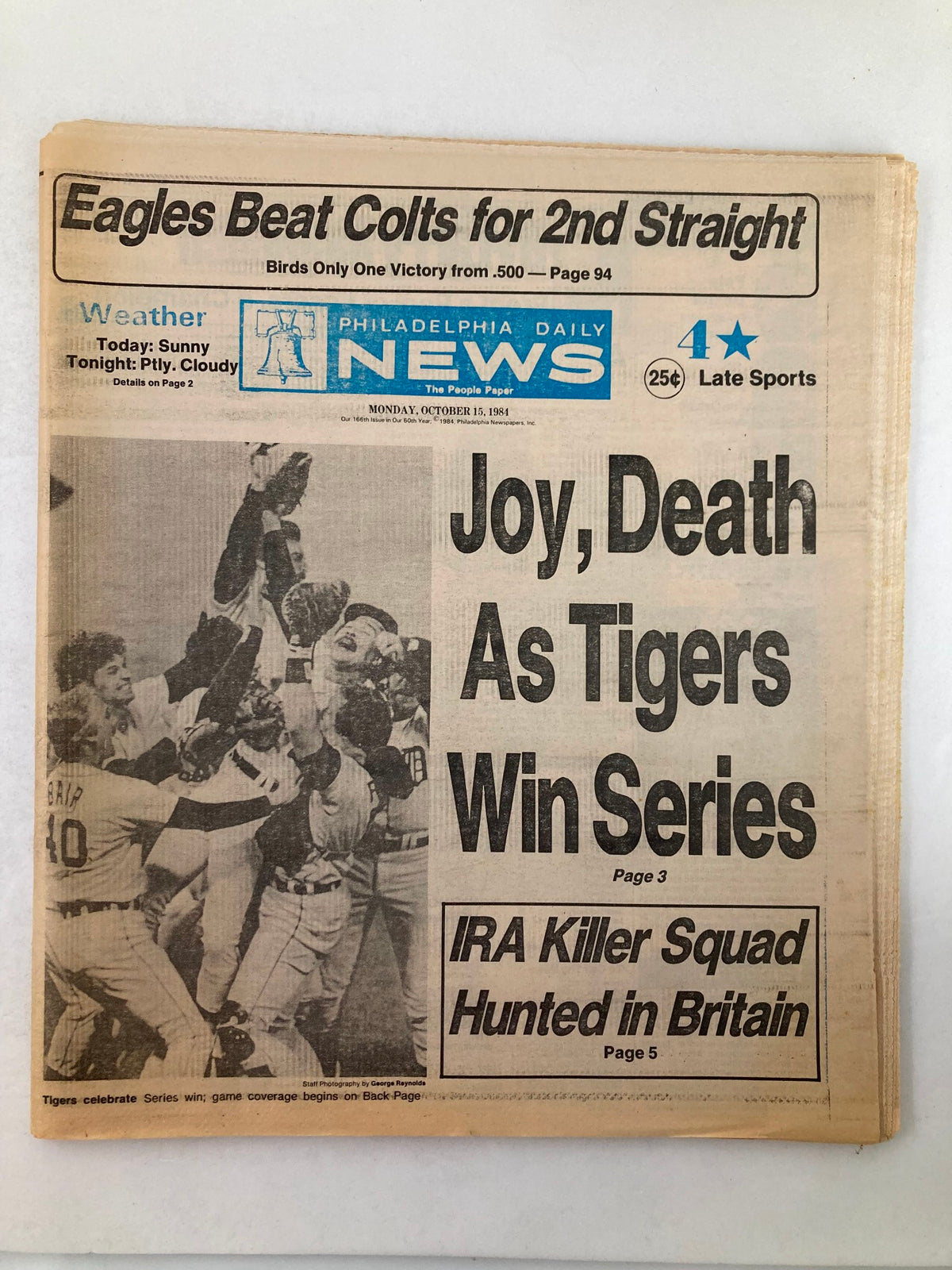 Philadelphia Daily News Tabloid from October 15, 1984, featuring the headline 'Joy, Death As Tigers Win Series' with a celebratory image of the Detroit Tigers players celebrating their World Series victory.