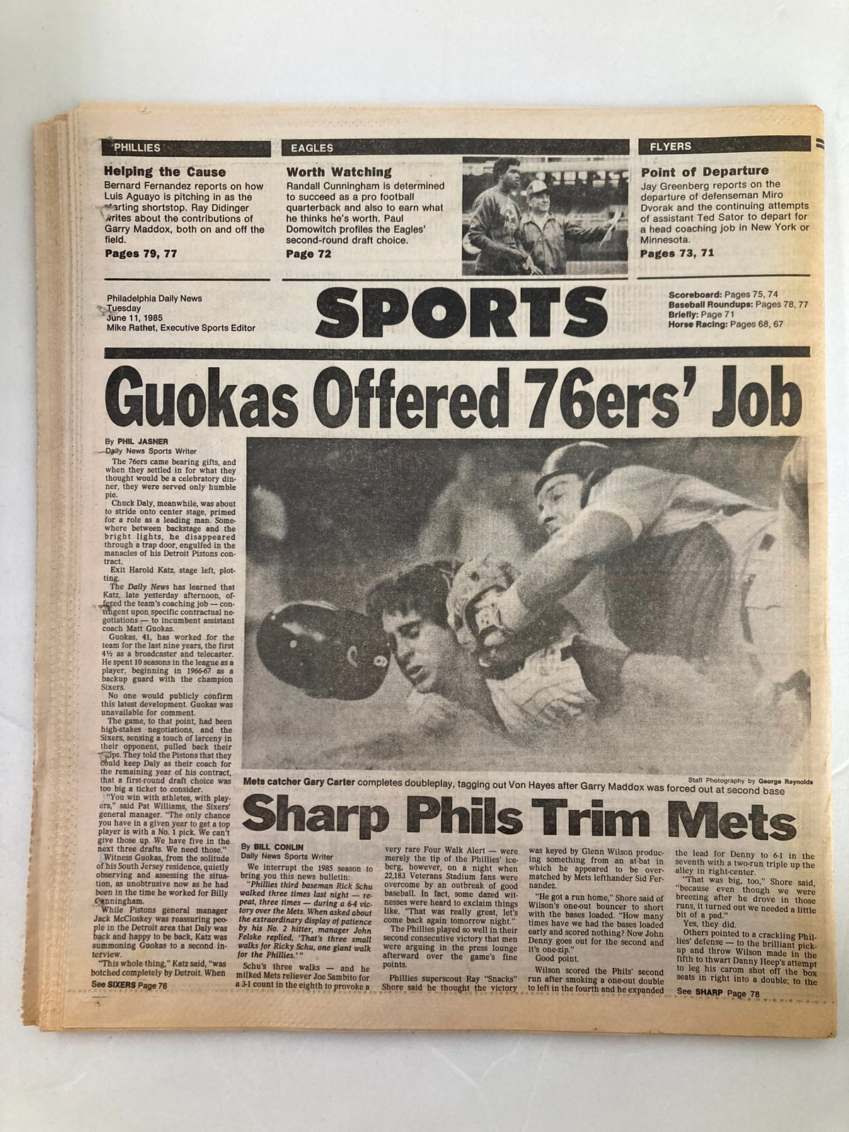 Philadelphia Daily News sports section from June 11, 1985, highlighting the 76ers and Mets with articles discussing various sports events and player performances.