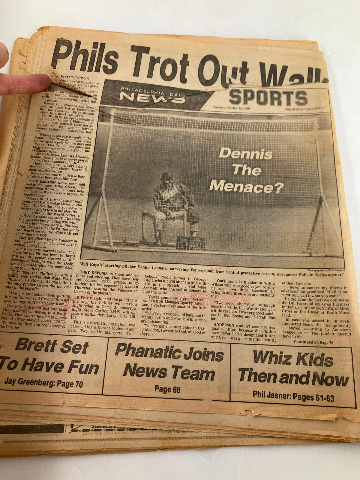 Philadelphia Daily News Tabloid from October 14, 1980, featuring an article about the Philadelphia Phillies titled 'Phils Trot Out Walk', along with a section discussing player Dennis Leonard. The tabloid shows signs of age with visible wear, including creases and rips, indicating its collectible status.
