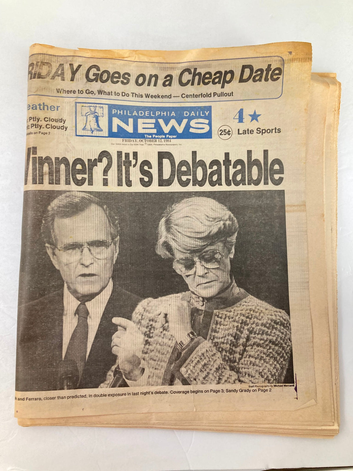 Philadelphia Daily News tabloid from October 12, 1984, featuring a headline about a political debate with images of participants discussing the outcome.