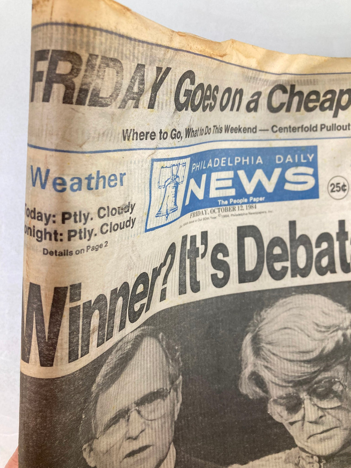 Close-up of the Philadelphia Daily News tabloid, dated October 12, 1984, highlighting the political debate topic and featuring notable images.