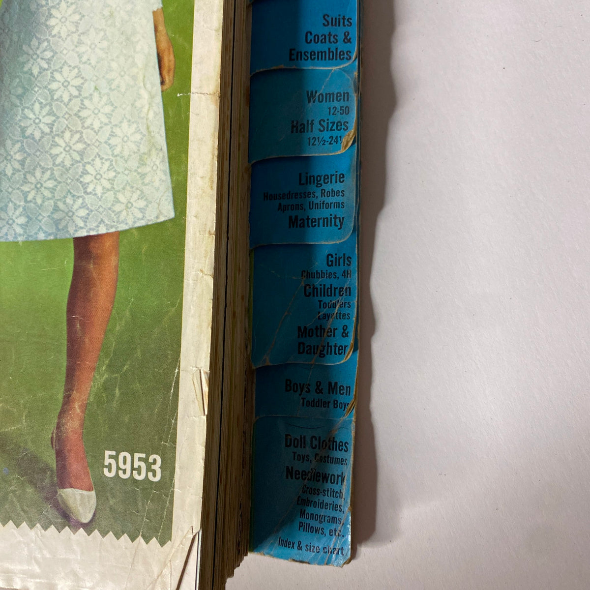 Side view of the 1965 May Simplicity Catalog displaying dress options for women, including Lingerie, Girls, and Maternity wear.
