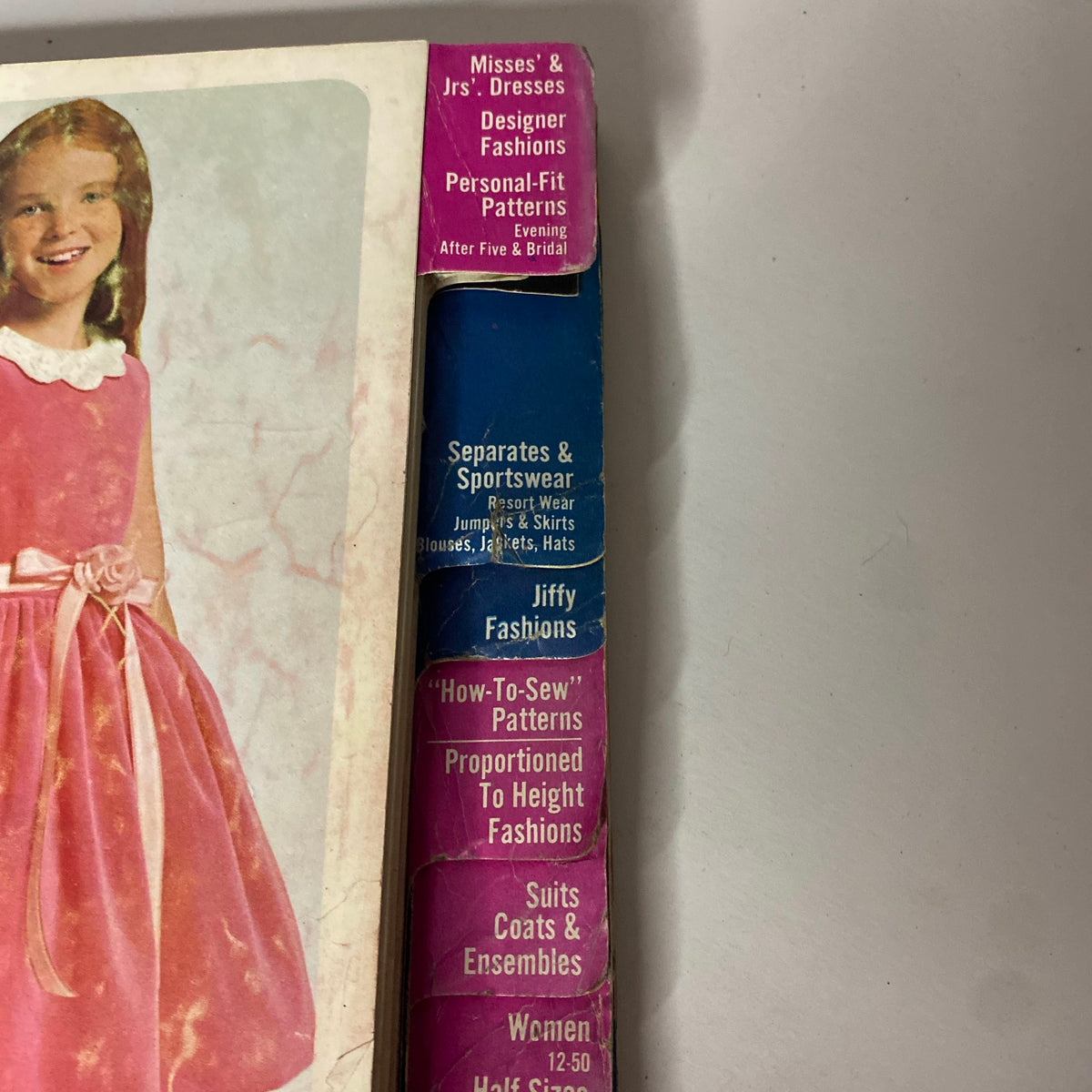 Cover of the 1965 December Simplicity Christmas Catalog sewing pattern, showcasing children's dresses and sewing pattern categories including Misses' and Jrs' dresses, personal-fit patterns, and more.