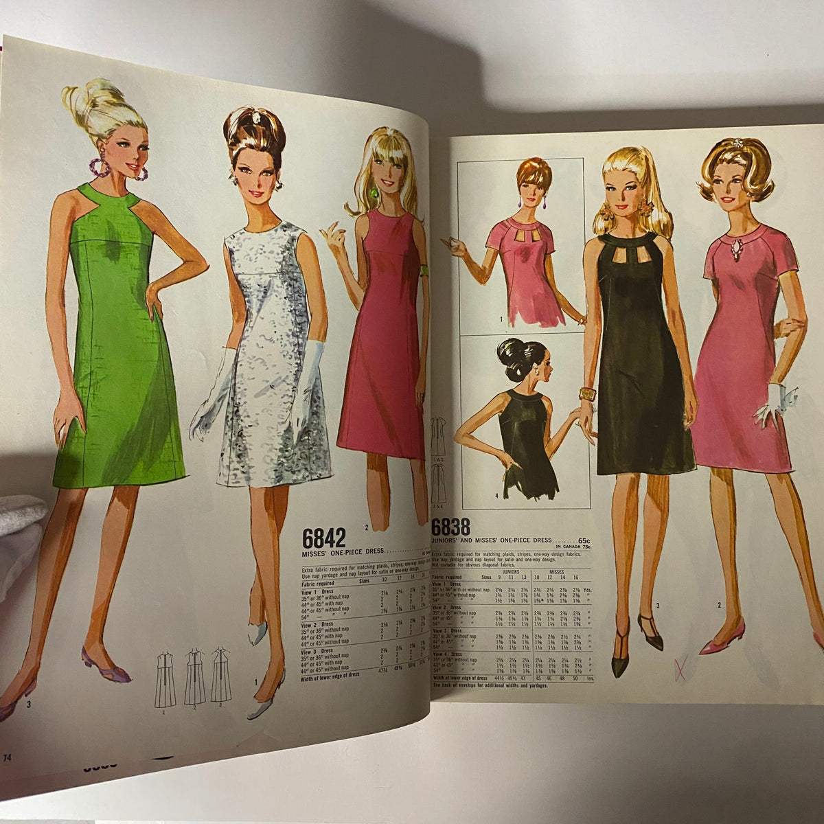 Interior page from the 1967 January Simplicity Catalog displaying fashion illustrations of Misses' one-piece dresses, emphasizing stylish options in vibrant colors.