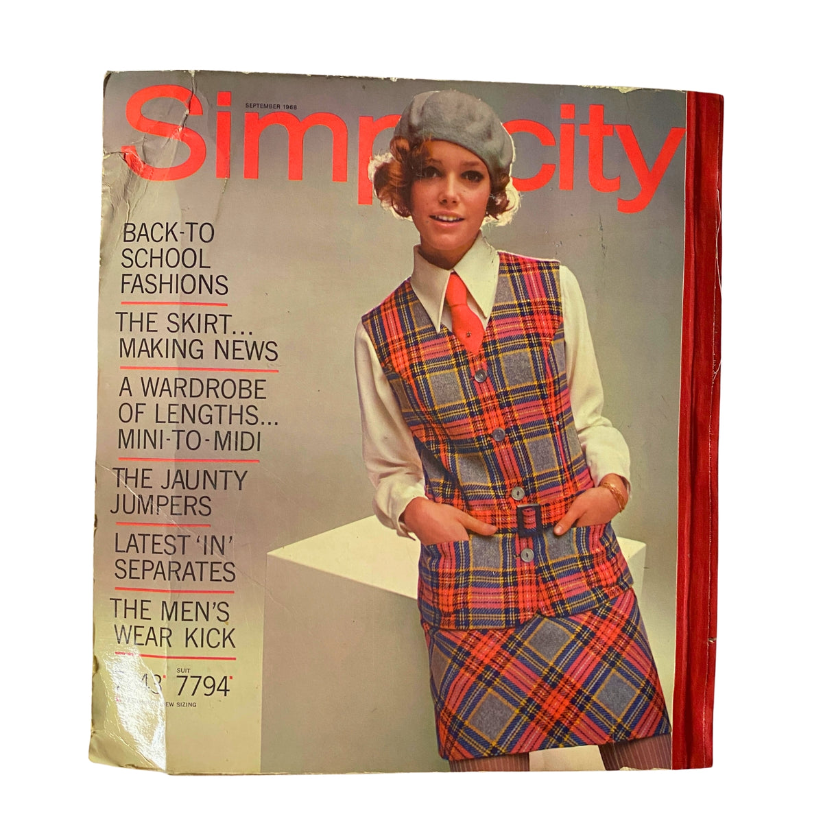 Cover of the 1968 September Simplicity Catalog, featuring back-to-school fashion ideas and a model in a trendy plaid outfit.
