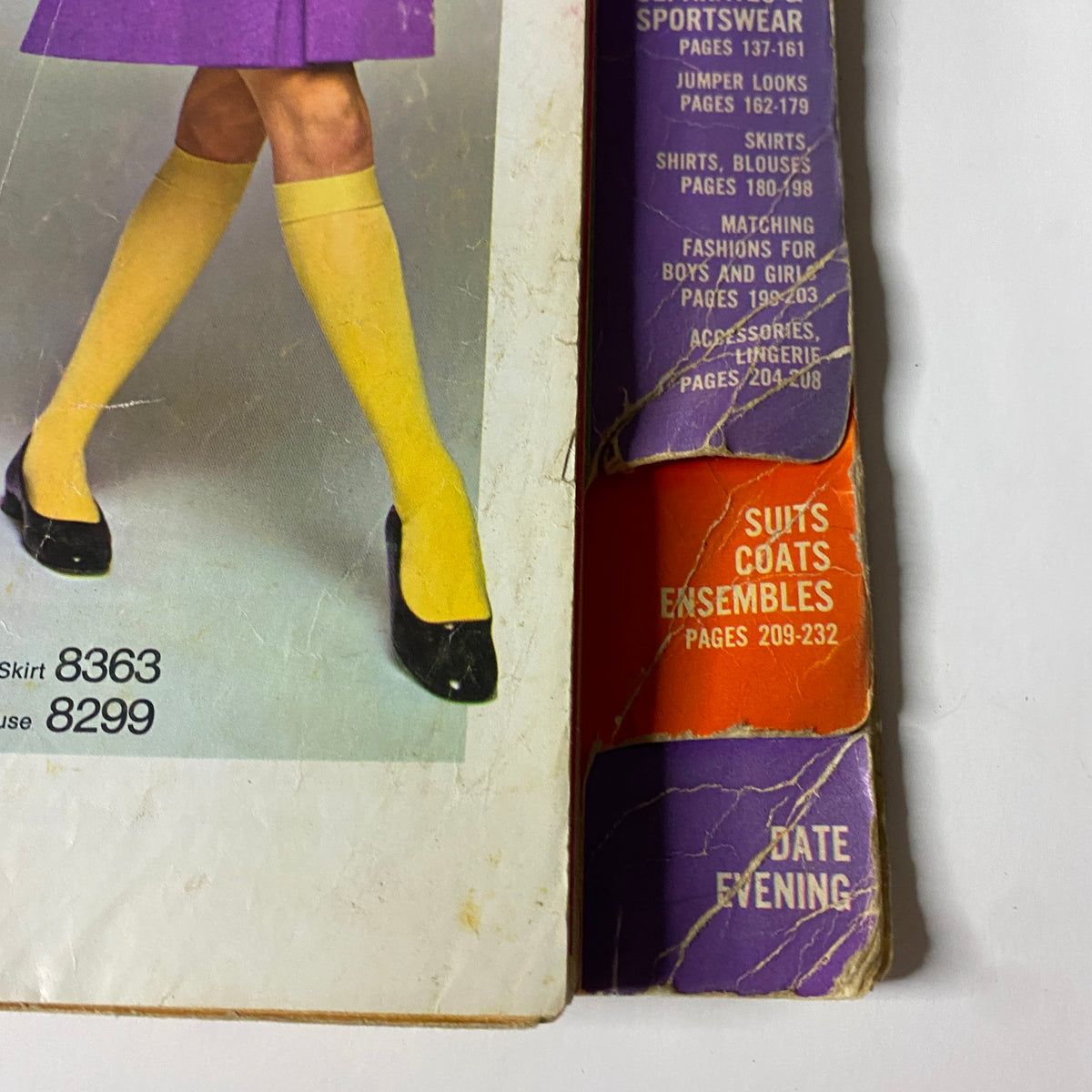 Fashion illustration from the 1969 Simplicity Fall and Winter School Catalog showcasing a model wearing a purple skirt and yellow tights, with sections for Separates & Sportswear and Suits & Coats.