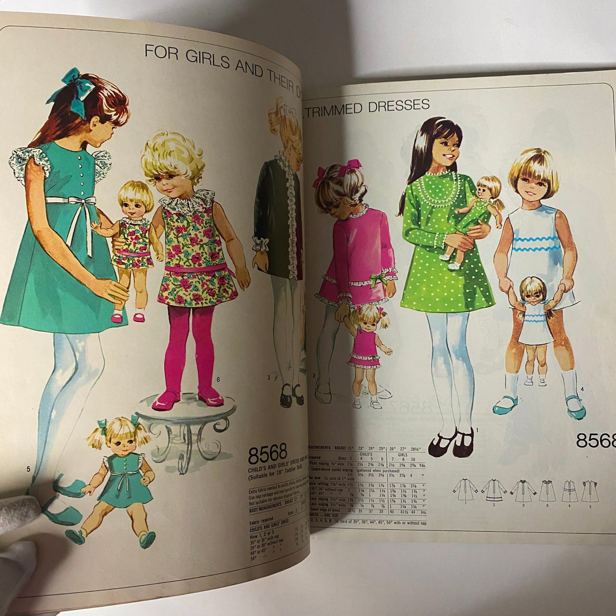 1969 Simplicity Holiday Catalog displaying a page with children's and dolls' clothing patterns promoting coordinated outfits.