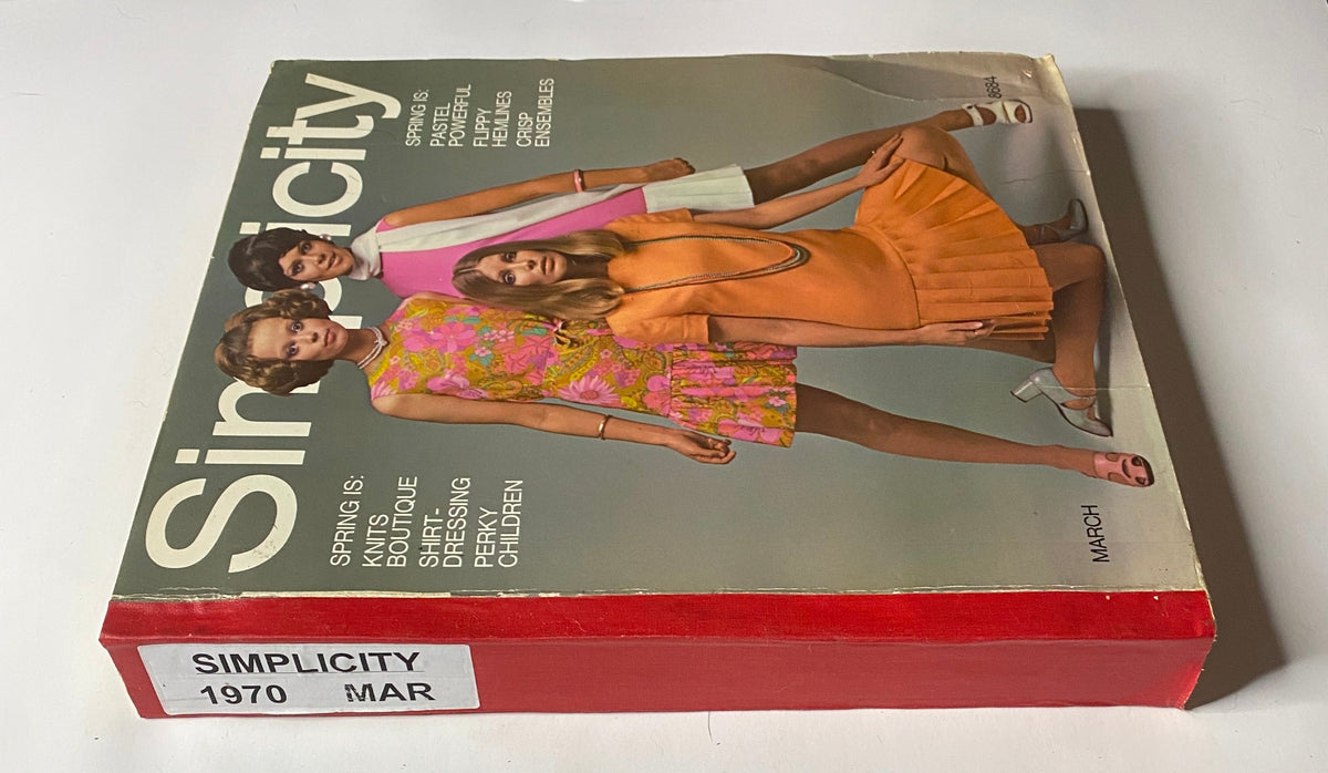 Side view of the 1970 March Simplicity Spring Catalog revealing the title and colorful sections, a valuable resource for sewing patterns reflecting early 1970s style.