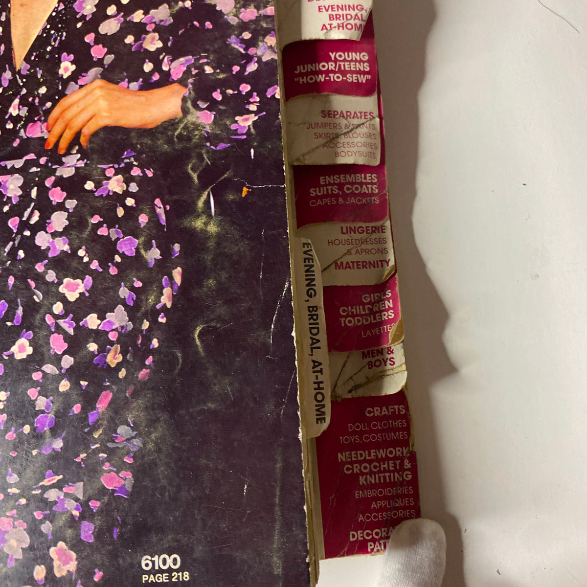Side view of fashion categories in the 1973 January Simplicity Catalog, highlighting options for Dresses, Evening, Bridal, At-Home patterns, and various styles for young audiences.
