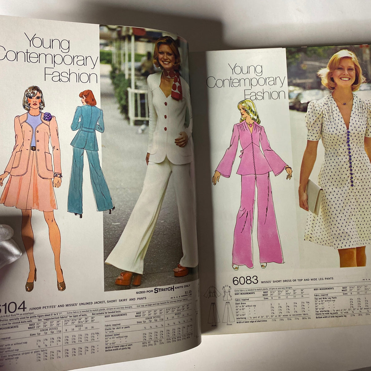 Young Contemporary Fashion section in the 1973 January Simplicity Catalog featuring stylish outfits for women, including suits and dresses, promoting a fresh take on 1970s fashion.