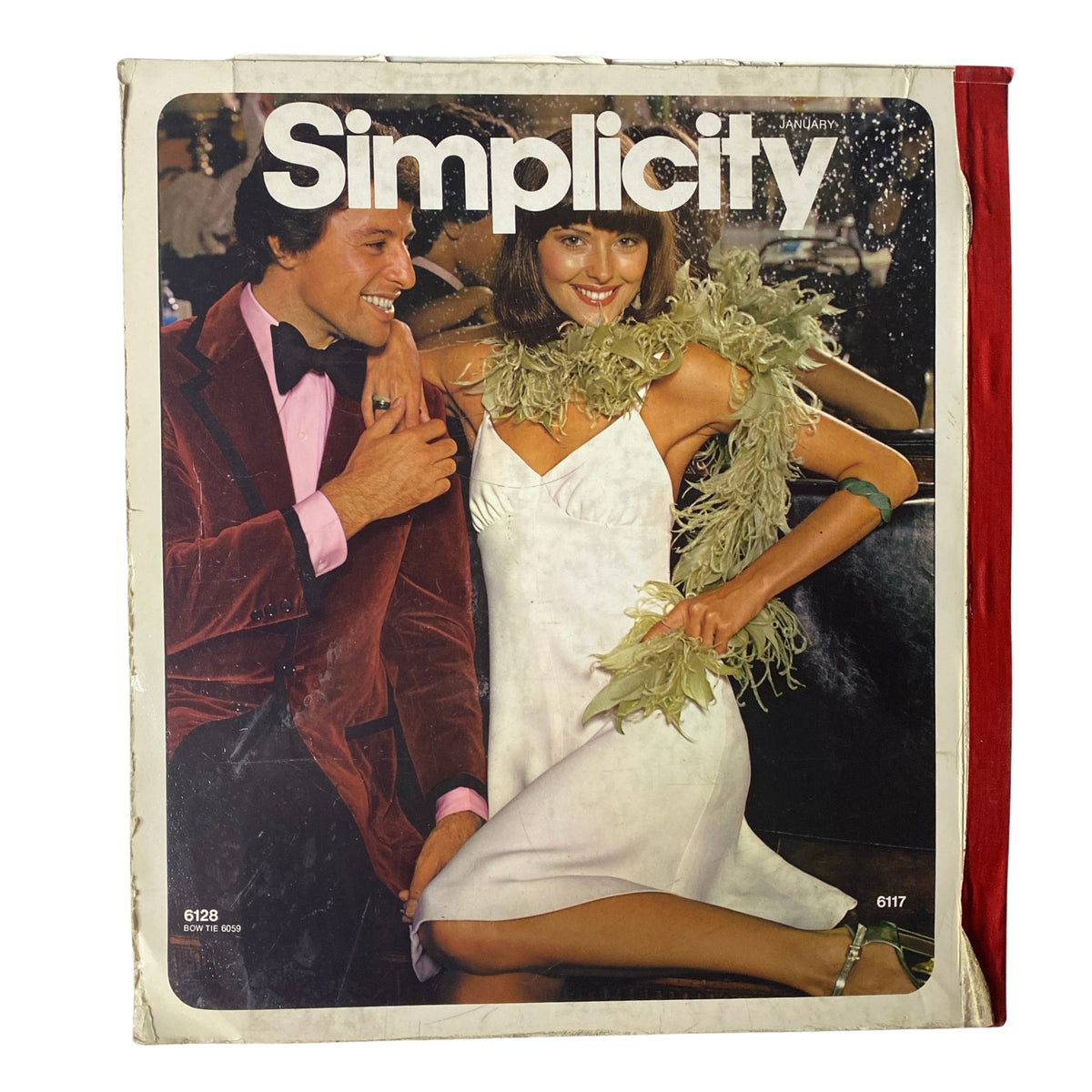 1973 January Simplicity Catalog cover featuring a couple in stylish outfits. Highlights the vintage fashion trend with a focus on sewing and dressmaking inspiration.
