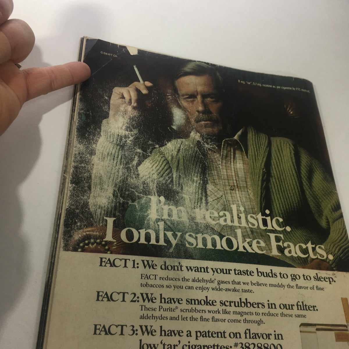Close-up of the cover of the Sports Illustrated Magazine from January 23, 1978, featuring an advertisement advocating for using fact-based decisions, alongside a vintage image of a man with a cigarette. The magazine highlights legendary athletes Danny White and Harvey Martin.