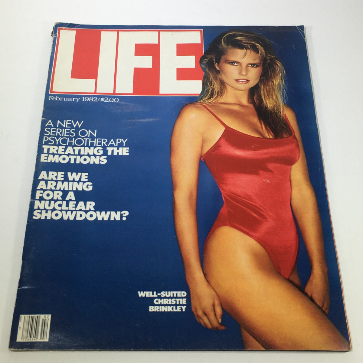 Cover of February 1982 Life Magazine featuring Christie Brinkley in a red swimsuit posing elegantly, highlighting the vintage charm of the early 80s.